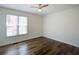 Bedroom features wood floors and a window for plenty of natural light at 2228 Arbor Forest Sw Trl, Marietta, GA 30064