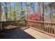 Wooden deck surrounded by lush trees and a beautiful view at 2228 Arbor Forest Sw Trl, Marietta, GA 30064