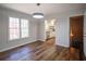 Dining room with hardwood floors and contemporary lighting fixture at 2228 Arbor Forest Sw Trl, Marietta, GA 30064