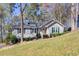 Charming single-story home with well-maintained lawn, inviting entrance, and a cozy, traditional style at 2228 Arbor Forest Sw Trl, Marietta, GA 30064