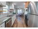 Modern kitchen featuring stainless steel appliances, granite countertops, and wood flooring at 2228 Arbor Forest Sw Trl, Marietta, GA 30064