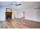 Bright living room features vaulted ceilings, a brick fireplace, and wood flooring at 2228 Arbor Forest Sw Trl, Marietta, GA 30064