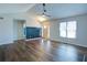 Bright living room featuring beautiful laminate flooring, a modern ceiling fan, and ample natural light at 2228 Arbor Forest Sw Trl, Marietta, GA 30064