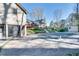 Backyard with covered pool, detached garage, deck, and enclosed sunroom for indoor-outdoor living at 3189 Terramar Dr, Atlanta, GA 30341