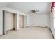 The bedroom offers neutral walls and carpet, a ceiling fan, and an entry to an ensuite bathroom at 3189 Terramar Dr, Atlanta, GA 30341