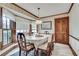 Traditional dining room featuring wallpaper, wood trim, and large windows for natural light at 3189 Terramar Dr, Atlanta, GA 30341