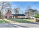 Classic brick home with a lush front yard and mature trees offering curb appeal and charm at 3189 Terramar Dr, Atlanta, GA 30341