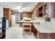 Spacious kitchen features wood cabinetry, white countertops, and a large island for food preparation at 3189 Terramar Dr, Atlanta, GA 30341