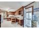 Traditional eat-in kitchen with wood cabinets, white counters, and a doorway to a sunroom at 3189 Terramar Dr, Atlanta, GA 30341