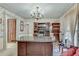 Home office includes custom built-ins, large desk, and a chandelier for a professional feel at 3189 Terramar Dr, Atlanta, GA 30341