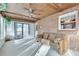 Comfortable sunroom with brick wall, sliding glass doors and a futon at 3189 Terramar Dr, Atlanta, GA 30341