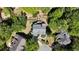 A beautiful aerial view showcasing a well-manicured property nestled among mature trees and neighboring houses at 320 N Drew Ct, Duluth, GA 30097