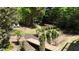 Serene backyard with lush landscaping, a wooden bridge, and a dedicated play area for  at 320 N Drew Ct, Duluth, GA 30097