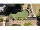Aerial view of the backyard with putting green, manicured landscaping, and cozy deck. Perfect for entertaining at 320 N Drew Ct, Duluth, GA 30097