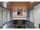 Elegant bar area with a zebra print TV, a marble countertop, and wine coolers at 320 N Drew Ct, Duluth, GA 30097