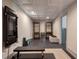 Home gym with tonal workout system, bench, weights, dark floors, and shelving units at 320 N Drew Ct, Duluth, GA 30097