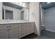 Bathroom featuring a double sink vanity with marble countertops and tiled floors at 320 N Drew Ct, Duluth, GA 30097
