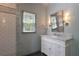 Bathroom featuring a shower with subway tile, marble vanity and a view from the window at 320 N Drew Ct, Duluth, GA 30097