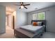 Cozy bedroom featuring plush carpeting, ceiling fan and neutral decor at 320 N Drew Ct, Duluth, GA 30097