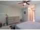 Neutral bedroom with a ceiling fan, a gray dresser, and gray carpet at 320 N Drew Ct, Duluth, GA 30097