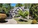 Charming two-story brick home featuring a two-car garage and landscaped front yard at 320 N Drew Ct, Duluth, GA 30097