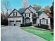 Charming two-story traditional home with manicured lawn and a two-car attached garage at 320 N Drew Ct, Duluth, GA 30097