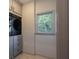 Functional laundry room featuring gray cabinetry and modern appliances at 320 N Drew Ct, Duluth, GA 30097