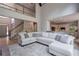 Spacious living room showcasing a staircase and open flow to the kitchen at 320 N Drew Ct, Duluth, GA 30097