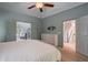 Spacious main bedroom with hardwood flooring and ensuite access to bathroom and walk-in closet at 320 N Drew Ct, Duluth, GA 30097