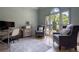 Comfortable home office with large arched window and plush chairs at 320 N Drew Ct, Duluth, GA 30097