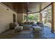 Covered patio with outdoor furniture, ceiling fans and a view of the landscaped backyard at 320 N Drew Ct, Duluth, GA 30097