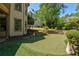 Beautiful backyard putting green with well-manicured landscaping and stone accents at 320 N Drew Ct, Duluth, GA 30097