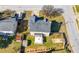 Aerial view of the backyard featuring a patio, shed, and grassy lawn at 401 Windstream Sw Dr, Marietta, GA 30060