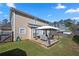 Grassy backyard featuring a patio with covering and comfortable furniture at 401 Windstream Sw Dr, Marietta, GA 30060