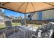 Backyard with a covered patio, comfortable seating and a well-maintained lawn at 401 Windstream Sw Dr, Marietta, GA 30060