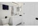 Cozy bathroom featuring modern sink, toilet, and lots of storage at 401 Windstream Sw Dr, Marietta, GA 30060