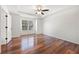 Large bedroom featuring hardwood floors, large window, and white walls at 401 Windstream Sw Dr, Marietta, GA 30060