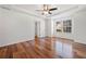 Spacious primary bedroom featuring tray ceilings, a ceiling fan, and lots of natural light at 401 Windstream Sw Dr, Marietta, GA 30060