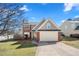 Charming two-story home with a well-manicured lawn and a two-car garage at 401 Windstream Sw Dr, Marietta, GA 30060