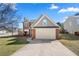 Charming two-story home with a well-manicured lawn and a two-car garage at 401 Windstream Sw Dr, Marietta, GA 30060