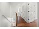 Upstairs hallway with hardwood floors and access to multiple rooms at 401 Windstream Sw Dr, Marietta, GA 30060