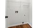 Small, unfinished laundry room with shelving and hookups at 401 Windstream Sw Dr, Marietta, GA 30060