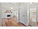 Living room featuring fireplace, wood floors, and view into dining area at 401 Windstream Sw Dr, Marietta, GA 30060