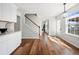 Bright living area features hardwood floors, lots of natural light, and a staircase at 401 Windstream Sw Dr, Marietta, GA 30060