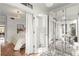 Bedroom connected to glass enclosed office with hardwood flooring and contemporary lighting at 130 26Th Nw St # 807, Atlanta, GA 30309