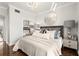 Bright bedroom with decorative mirror and lamps, hardwood floors and light walls at 130 26Th Nw St # 807, Atlanta, GA 30309