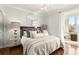Bedroom with contemporary lighting and lamps adjacent to glass enclosed office at 130 26Th Nw St # 807, Atlanta, GA 30309