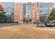 Brick building with manicured lawn and surface parking, plus convenient gated entrance at 130 26Th Nw St # 807, Atlanta, GA 30309