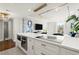 Bright kitchen featuring a modern island, stainless appliances, and beautiful lighting, perfect for cooking and entertaining at 130 26Th Nw St # 807, Atlanta, GA 30309