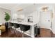 Open kitchen design with a bar, modern appliances, and stylish pendant lighting, ideal for social gatherings at 130 26Th Nw St # 807, Atlanta, GA 30309